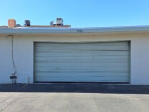 Open Sesame technician replacing snapped torsion springs on a residential garage door in Sun City Summerlin, near Del Webb Blvd in zip code 89134.