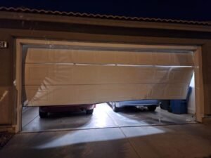 Fixing an off-track garage door blown out by high winds in The Paseos village of Summerlin West, located near Far Hills Ave in 89138.