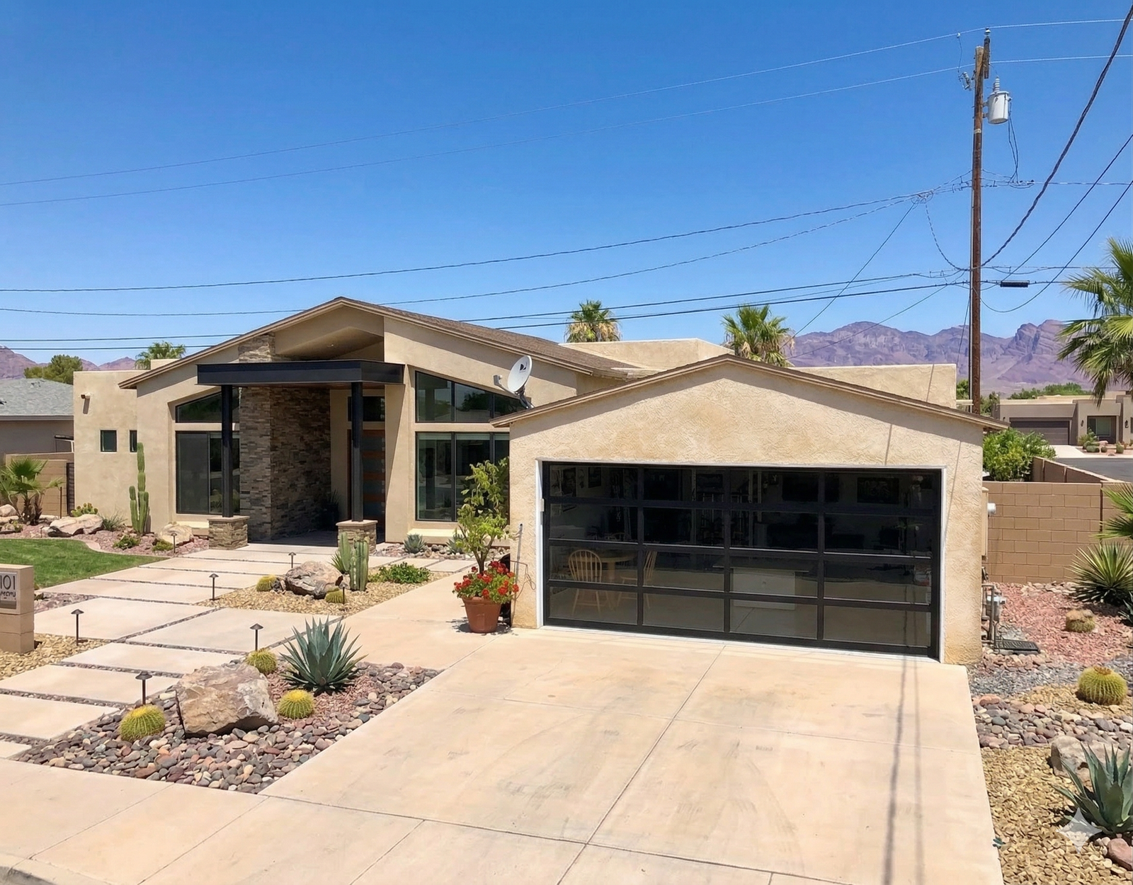 Modern black aluminum glass garage doors installed for a home in Las Vegas, NV