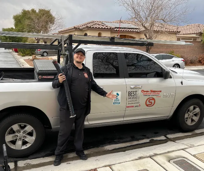 Open Sesame garage door repair technician with the company truck at a Las Vegas home